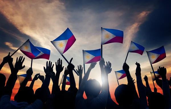 depositphotos_74835839-stock-photo-people-waving-filipino-flags.jpg